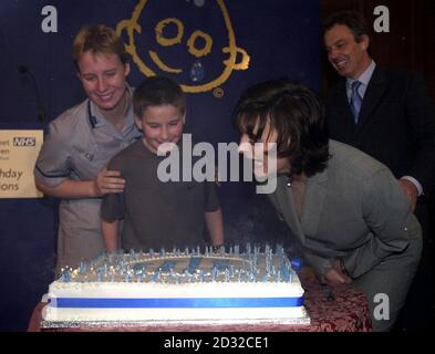 Cherie Blair (right), accompanied by her husband Prime Minister Tony Blair, helps former patient Robbie Pearce and Nurse Pippa Humm to blow out the 150 candles on a cake to celebrate the 150th Anniversary of Great Ormond Street Hospital For Children.  * ... at a luncheon in London's Guildhall. Robbie, from Marlow, Buckinghamshire, was celebrating his own 11th birthday and the 11th anniversary of lifesaving surgery carried out at the hospital for a rare windpipe defect within hours of his birth.  Stock Photo