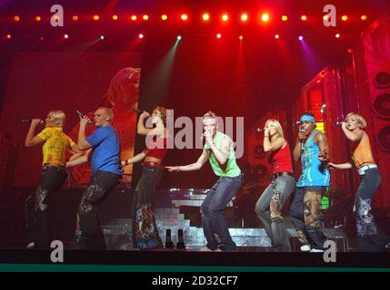 Pop group S Club 7, from left to right; Jo, Paul, Tina, Jon, Rachel, Bradley and Hannah, perform on stage at Wembley Arena in London. The gig is the first of three nights here, on the London stint of their UK tour. Stock Photo