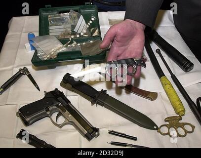 A selection of drugs and weapons on display at the launch of the Safer Clubbing guide, introduced by Home Office Drugs Minister Bob Ainsworth at a news conference Government's Safer Clubbing guide at AKA bar, part of The End nightclub in London's West End. The booklet marks a shift in Home Office policy by placing more emphasis on managing the use of illegal substances like ecstasy rather than penalising clubs and drug users. The new direction may even contradict the Government's own legislation, which makes it illegal for owners to tolerate drug use on their premises. The development comes af Stock Photo