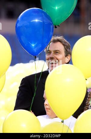 Prime Minister Tony Blair helps to launch balloons to mark the handing over of the City of Manchester Stadium, the chief venue for the Commonwealth Games which was handed over to the Commonwealth games committee.  Stock Photo