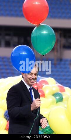 Prime Minister Tony Blair helps to launch balloons to mark the handing over of the City of Manchester Stadium, the chief venue for the Commonwealth Games which was handed over to the Commonwealth games committee.  Stock Photo