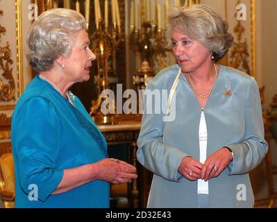 Britain's Queen Elizabeth II meets the Baroness Hayman, Chairman of Cancer Research UK at a Cancer Research UK,  reception at Buckingham Palace, London. Stock Photo