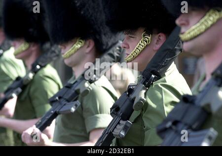 Members of Number 7 Company Coldstream Guards take part in a rehearsal at Chelsea Barracks, London, for the procession that will move the  Queen Mother's coffin from the Queen's Chapel at St James' Palace to Westminster Hall, where it will lie-in-state until her funeral. Stock Photo