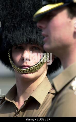 Captain Hamilton (right) and Lieutenant d'Apice, members of Number 7 Company Coldstream Guards, at Chelsea Barracks, London, during a rehearsal for the moving of the Queen Mother's coffin on Friday which will be taken from the Queen's Chapel at St James' Palace.  *...to Westminster Hall.  Stock Photo