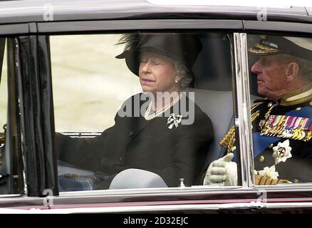 Britain's Queen Elizabeth II and the Duke of Edinburgh are driven from Westminster Abbey, London, after the funeral of Queen Elizabeth the Queen Mother.  After the service, the Queen Mother's coffin will be taken to St George's Chapel in Windsor.  *...where she will be laid to rest next to her husband, King George VI. Stock Photo