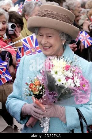 The Queen is greeted by the public, as she walks through Mowbray Park, Sunderland. The Queen arrived in Sunderland today on the second leg of her nationwide Golden Jubilee tour. Accompanied by the Duke of Edinburgh, she travelled overnight to the North East on the Royal Train. Stock Photo