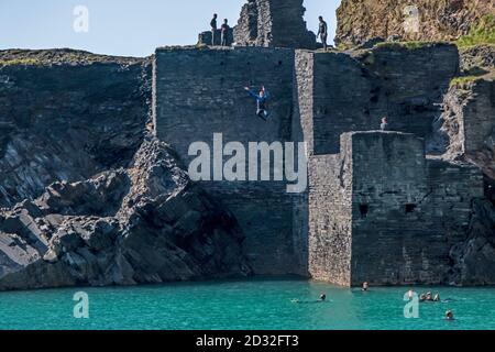 The Blue Lagoon at Abereiddi is one of the best examples in Pembrokeshire of a sea quarry , and popular for coasteering , swimming and diving. Stock Photo