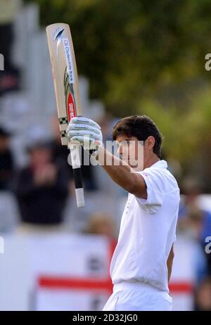 England's Alastair Cook celebrates scoring 100 not out during Day Four of the First Test at the University Oval, Dunedin, New Zealand. Stock Photo