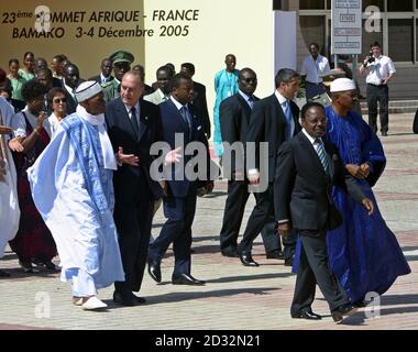 French President Jacques Chirac (2nd L) and Senegal's President Aboulaye Wade (L) talk as Gabon President Omar Bongo (2nd R) and Mali's President Amadou Toumani Toure (R) walk in front of them during the opening ceremony of the Franco-African Summit in Bamako December 3, 2005.
