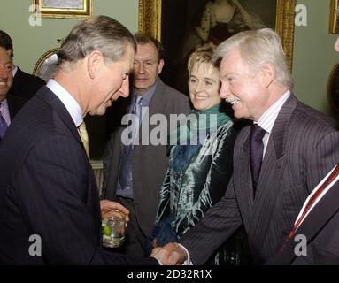 The Prince of Wales shakes hands with actor Sir Derek Jacobi, as actress Sinead Cussack (centre) looks on, during a reception for Actors of the Royal Shakespeare Company of which the Prince is President, at Home House, central London. Stock Photo