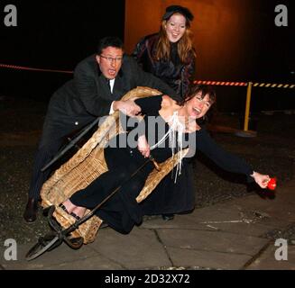 Celebrity student comedienne Doon Mackichan attempts to leave with the help of TV presenter Rowland Rivron after being evicted from the Comic Relief does Fame Academy in north London. Stock Photo