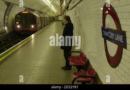 Passengers arrive on the first London Underground westbound passenger train at Chancery Lane in central London since a derailment there on January 25.   *  The train was the 05.53 travelling to Ealing Broadway through the tunnel where the derailment had occurred. London Underground plan to have the entire line up and running by Easter although a shortage of gearbox couplings will prevent the 85-strong train fleet from being ready until a later date still. Some of London Underground s busiest stations which have been closed following a Central Line derailment will reopen Thursday April 03 2003. Stock Photo