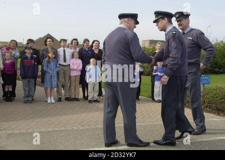 Honorary Air Commodore at RAF Lossiemouth Prince Andrew meets families of of air crewman who are involved in the conflict in the Gulf.   * He is pictured on arrival meeting Padre Rev. Squadron Leader Bryan Mcneil (left)  with acting station Commander, Wing commander David Bye(right.) Prince Andrew today paid a morale boosting visit to families whose loved ones are serving in the Gulf. The Duke of York travelled to RAF Lossiemouth in Moray, Scotland, where he met wives, partners and children of personnel stationed at the base. Stock Photo