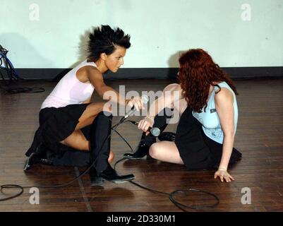 Russian duo t.A.T.u Julia Volkova (left) and Lena Katina, performing on stage at HMV Oxford Street, where they signed copies of their debut album '200Km/h In The Wrong Lane'. Stock Photo