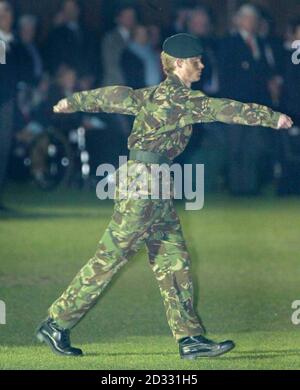 Prince Harry, youngest son of the Prince of Wales and grandson of  Queen Elizabeth II, took charge of a 48-strong parade of military cadets at Eton, fuelling speculation that he may opt for a military career. Harry, 18, was appointed Commander of Eton's Combined Cadet Force's formal trooping of the colour ceremony. The Prince of Wales was among those looking on as his youngest son led the guard of honour's march out on to College Field with their colours at the yearly tattoo, held since  The Corps  was founded in 1860. Stock Photo