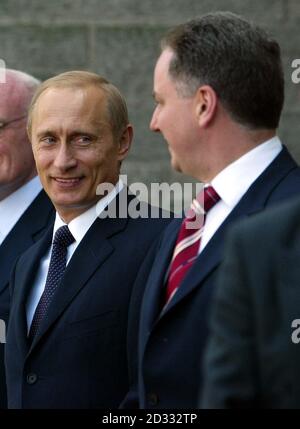 Russian President Vladimir Putin, centre, visits Dmitry Rogachev ...