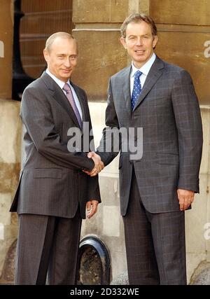 Russia s President Putin (left) shakes hand with British Prime Minister Tony Blair as they arrive at Lancaster House in London for a Russia-UK energy summit. * Later, after talks at Downing Street, President Putin, on the last full day of his state visit to Britain, was vsiting St Paul s Cathedral, the Tower of London and the Royal Observatory at Greenwich, and in the evening was hosting an official banquet at Spencer House attended by the Queen. 13/08/03 The BBC said Russian President Vladimir Putin authorised for the FBI to have an undercover agent sent to Russia. The arms dealer fle Stock Photo
