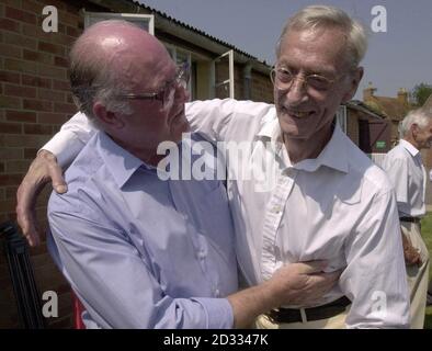 Great Train Robber Bruce Reynolds (right) meets former police officer John Woolley at Oakley Village Hall, Buckinghamshire, during a village fete.  Mr Woolley discovered the robbers had been using nearby Leatherslade Farm as a hideout during the planning and immediate aftermath of the robbery in 1963.   Stock Photo