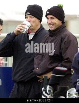 Former Manchester United goalkeeper Peter Schmeichel with football pundit Alan Hansen (right) during the first round of the celebrity pro-am in the Dunhill Links Championships at Carnoustie. Stock Photo