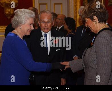 Britain's Queen Elizabeth II meets Mrs Cyril Reitman, watched by The Lord Janner of Braunstone (entre) President of The Commonwealth Jewish Council, at a reception to mark the 21st anniversary of the Commonwealth Jewish Council at St James's Palace, London. Stock Photo