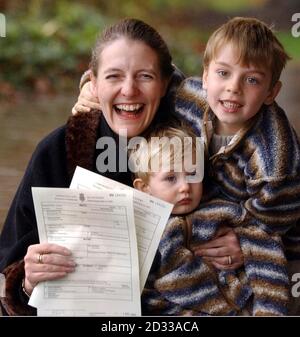 Diane Blood with sons Liam, four, and Joel, 16-months, shows birth certificates bearing the name of their father, outside Sheffield District Register Office, after Mrs Blood won her long legal battle to have her late partner Stephen, who died in 1995, legally recognised on the documents.The Human Fertilisation and Embryology (Deceased Fathers) Act 2003, which came into force today, gives mothers like Mrs Blood, whose children were conceived after their fathers' deaths, a six-month window in which to re-register their children's births if they now wish to name the deceased parent on the relevan Stock Photo