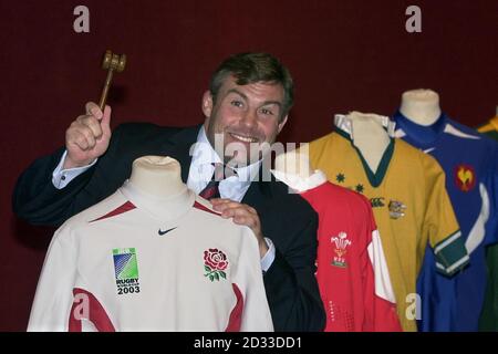 International Rugby player, Jason Leonard reveals his 2003 Rugby World Cup shirt collection to be auctioned at Christie's, London. Jason is leaning on his England 2003 Rugby World Cup final short-sleeved shirt, part of eight in the collection. Stock Photo