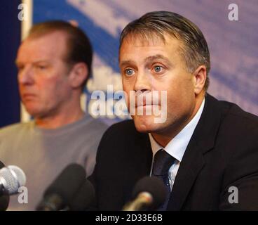 Micky Adams (R) seated with Director of football David Bassett, as he addresses a press conference held, at the Walkers Stadium, Leicester. The troubled Leicester City manager insisted his players were 'innocent until proven guilty' as they faced another night in a Spanish jail. No decision is expected to be made on bail for the three players despite attempts by their lawyers to get them released. Adams criticised the players for drinking too much during their warm weather break at the exclusive La Manga resort but said he knew several of the nine who were first arrested were 'not there' w Stock Photo
