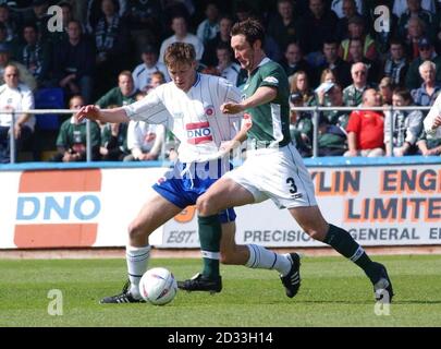 Plymouth Argyle's Lee Hodges (right) in action against Hartlepool's Anthony Sweeney during the Nationwide Division Two match at Victoria Park, Hartlepool, Saturday May 1, 2004.   THIS PICTURE CAN ONLY BE USED WITHIN THE CONTEXT OF AN EDITORIAL FEATURE. NO UNOFFICIAL CLUB WEBSITE USE. Stock Photo