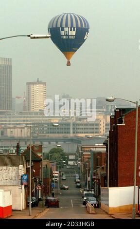 The 'Sky Orchestral music' is beamed down on the sleeping Birmingham population as five hot air baloons take to the skies from the city's Millennium Point. The event was organised to launch 'Fierce!' claimed to be the UK's boldest and most innovative live art festival which will run in the city until the 12th of June. Stock Photo