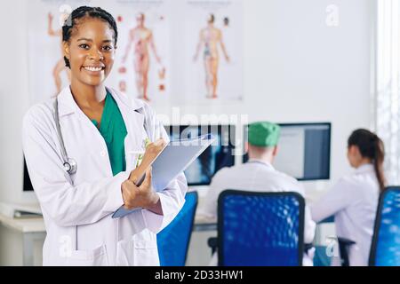 Physician filling document Stock Photo