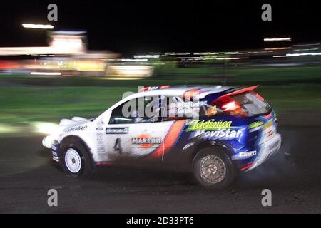 Colin McRae in his Ford Focus during Leg-One of the Network Q Rally of Great Britain at Cardiff, Wales. Stock Photo