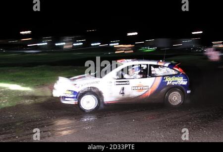 Colin McRae in his Ford Focus during Leg-One of the Network Q Rally of Great Britain at Cardiff, Wales. Stock Photo