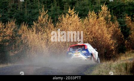 Colin McRae in his Ford Focus blasts through the St. Gwynno stage in the Rhondda Valleys of Wales in the Network Q Rally of Great Britain. Stock Photo