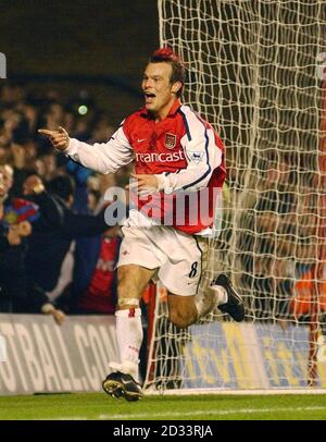 Fredrik Ljungberg celebrates scoring his goal for Arsenal, during their FA Barclaycard Premiership match against Liverpool at Arsenal's Highbury Stadium in London. THIS PICTURE CAN ONLY BE USED WITHIN THE CONTEXT OF AN EDITORIAL FEATURE. NO WEBSITE/INTERNET USE UNLESS SITE IS REGISTERED WITH FOOTBALL ASSOCIATION PREMIER LEAGUE. Stock Photo