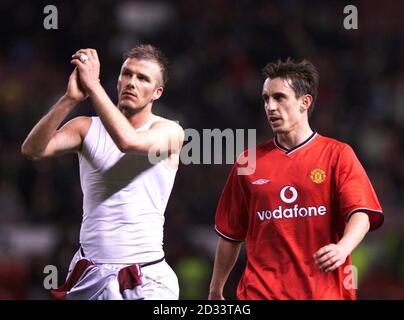 Manchester United's David Beckham (left) and Gary Neville walk off Old Trafford after dull 0-0 draw with Bayern Munich, during their Champions League Group A match at Old Trafford, Manchester. *THIS PICTURE CAN ONLY BE USED WITHIN THE CONTEXT OF AN EDITORIAL FEATURE. NO WEBSITE/INTERNET USE UNLESS SITE IS REGISTERED WITH FOOTBALL ASSOCIATION PREMIER LEAGUE.*  Stock Photo