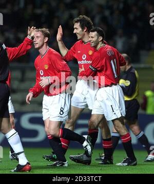 Manchester United's Laurent Blanc (centre) celebrates 1st goal against Boavista, with Paul Scholes (left) and captain Ryan Giggs, during Champions League game at the Estadio Do Bessa in Oporto. THIS PICTURE CAN ONLY BE USED WITHIN THE CONTEXT OF AN EDITORIAL FEATURE. NO WEBSITE/INTERNET USE UNLESS SITE IS REGISTERED WITH FOOTBALL ASSOCIATION PREMIER LEAGUE. Stock Photo