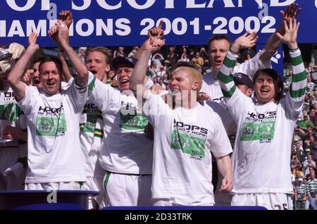 Celtic captain Paul Lambert (front left) leads the player celebrations with Neil Lennon (front centre) and Lubomir Moravcik (front right) after they retained the Scottish Premier League title with a win 5-1 over Livingston at the end of their Bank of Scotland Scottish Premiership game at Celtic Park, Glasgow. Stock Photo