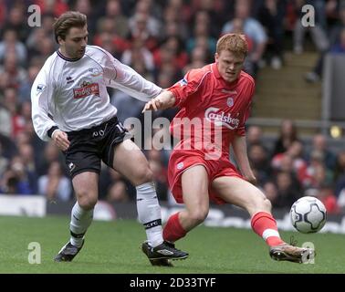 Liverpools John Arne Riise (right) challenges Derby County's Giorgi Kinkladze for the ball during their FA Barclaycard Premiership match at Liverpool's Anfield ground. Stock Photo