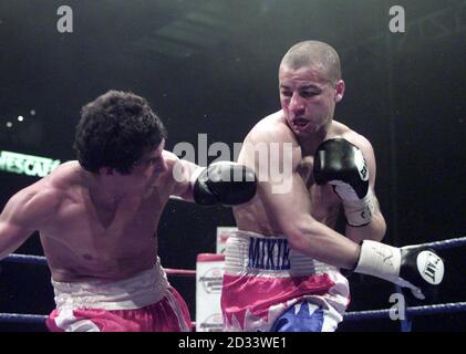 Manchester s Michael Brodie R punches Argentinian Pastor Maurin