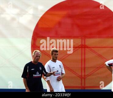 England manager Sven-Goran Eriksson (left) with captain David Beckham during an England training session in Awaji.  Coach Sven-Goran Eriksson is confident the Manchester United star will be fully recovered from his broken foot injury for the clash in Saitama. Stock Photo