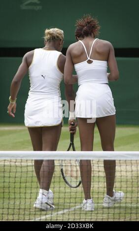 EDITORIAL USE ONLY, NO COMMERCIAL USE. Serena (left) and her sister Venus Williams from the USA during their Ladies' Doubles Semi-Final less than two hours after playing each other in the Ladies' Singles Final at Wimbledon.   * It is the first time in 118 years that sisters have met in the final at Wimbledon. Serena won in straight sets 7:6/6:3. Their doubles opponents were Anna Kournikova from Russia and Chanda Rubin from America. Stock Photo