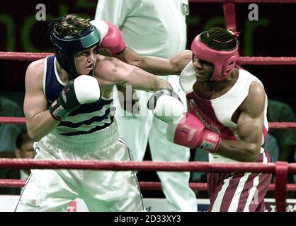 Englishman Paul Smith (left) gets struck with a counter punch while throwing a left hook, during his Silver medal performance, losing to Canada's Jean Pascal in the 71kg Light-Middleweight final in The Commonwealth Games, at Manchester Evening News Arena. Stock Photo