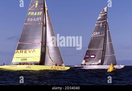 Britain's America's Cup team GBR Challenge (right) closes on the French yacht Le Defi Areva as they negotiate the windward mark in the Hauraki Gulf off Auckland, New Zealand. Eventually winning by just 13 seconds, it was GBR's first point in three races. Stock Photo