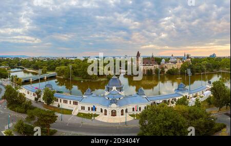 Floating lake in City park of BUdapest. Vajdahunyad castle on the background. Amazing lights in the morning. panoramic view Stock Photo