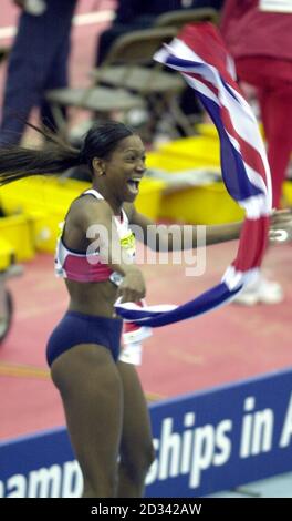 Great Britain's Ashia Hansen celebrates after winning gold at the 9th IAAF World Indoor Championships, National Indoor Arena, Birmingham. Stock Photo