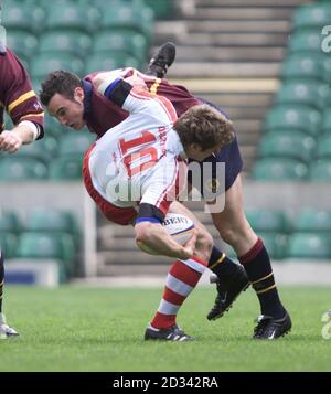 Northumbria's David Dalrymple is tackled by University of Wales Institute of Cardiff's (UWIC) Dean Fitzgerald, during the British Universities Sports Association's Rugby Union Championship Men's Final at Twickenham. Stock Photo
