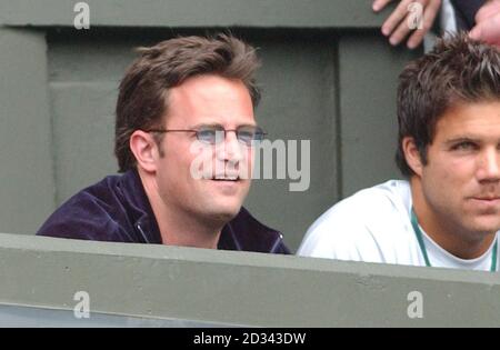 EDITORIAL USE ONLY, NO MOBILE PHONE USE 'Friends' actor Matthew Perry watches Jennifer Capriati in action against fellow American and defending champion Serena Williams in the ladies quarter finals at the All England Lawn tennis Championships at Wimbledon. Stock Photo