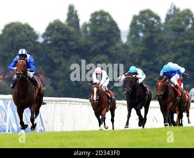 Ikhtyar ridden by jockey Richard Hills (far left) leaves the rest of the field behind on the way to winning the 'Gala Stakes' at Sandown Park. Stock Photo