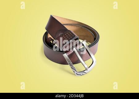 Brown fashion leather belt isolated on pastel color background with clipping path. Stock Photo