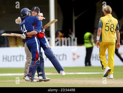 England's Paul Collingwood and Andrew Strauss (left) celebrate as Australia's Brett Lee walks past in dejection after the ICC Trophy Semi-Final at Edgbaston, Birmingham. England won by 6 wickets. EDITORIAL USE ONLY. NO MOBILE PHONE USE. Stock Photo